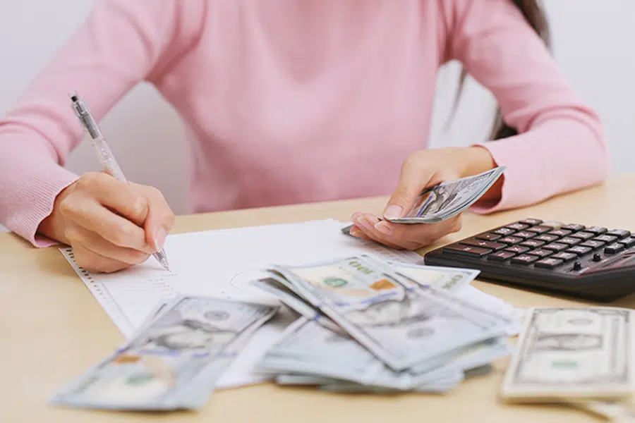 woman counting the money at home
